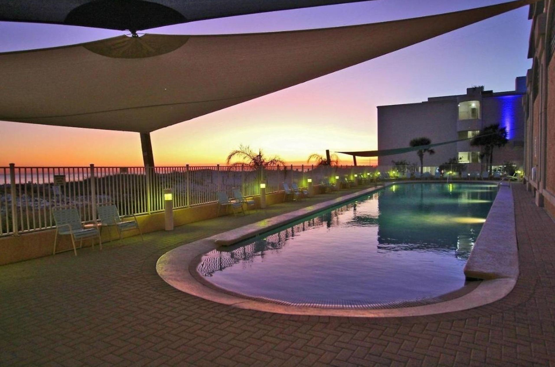 The waterfront swimming pool at sunset