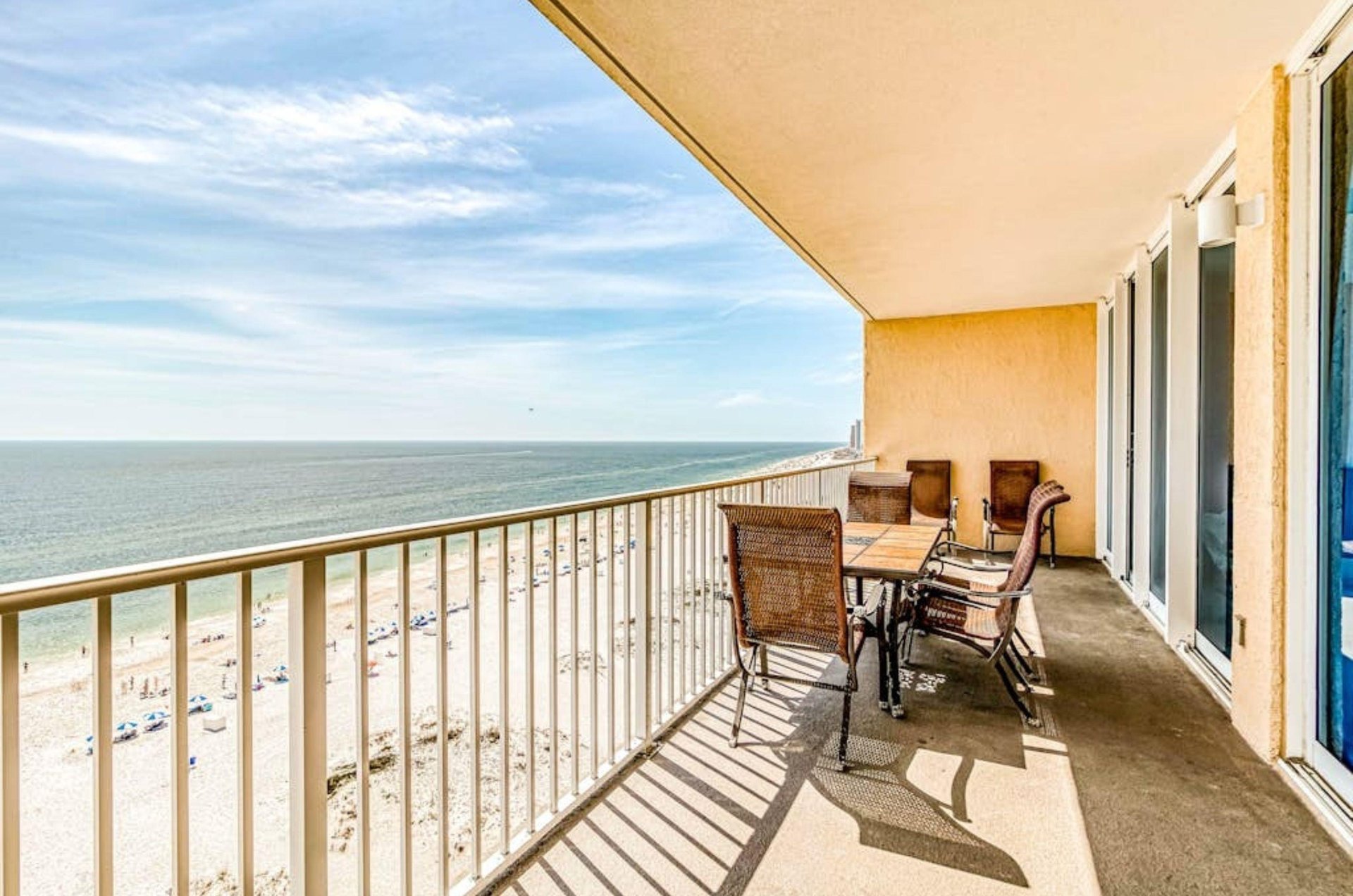 An outdoor balcony overlooking the beach