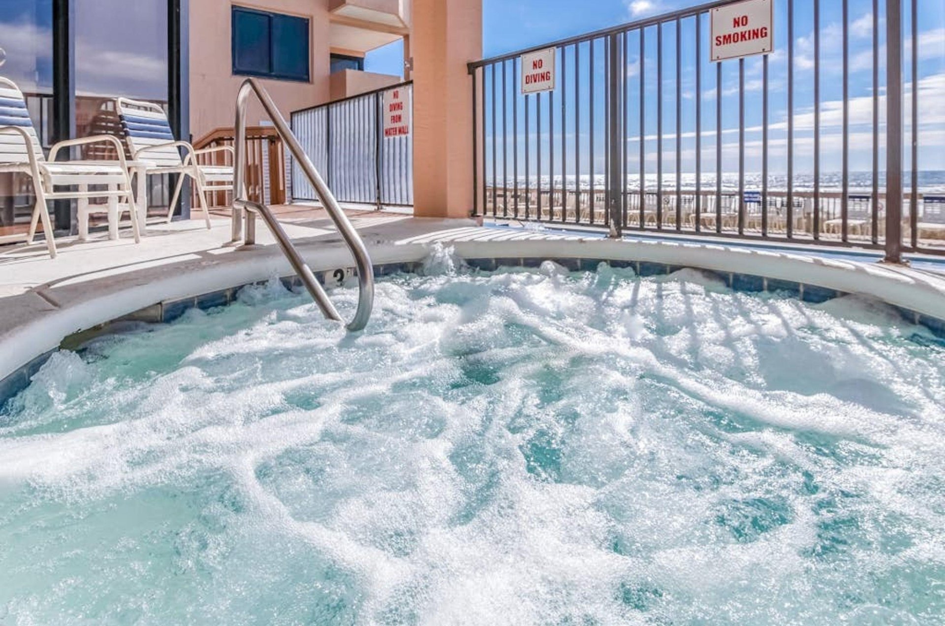 The beachside outdoor hot tub with jets at Broadmoor Condominiums