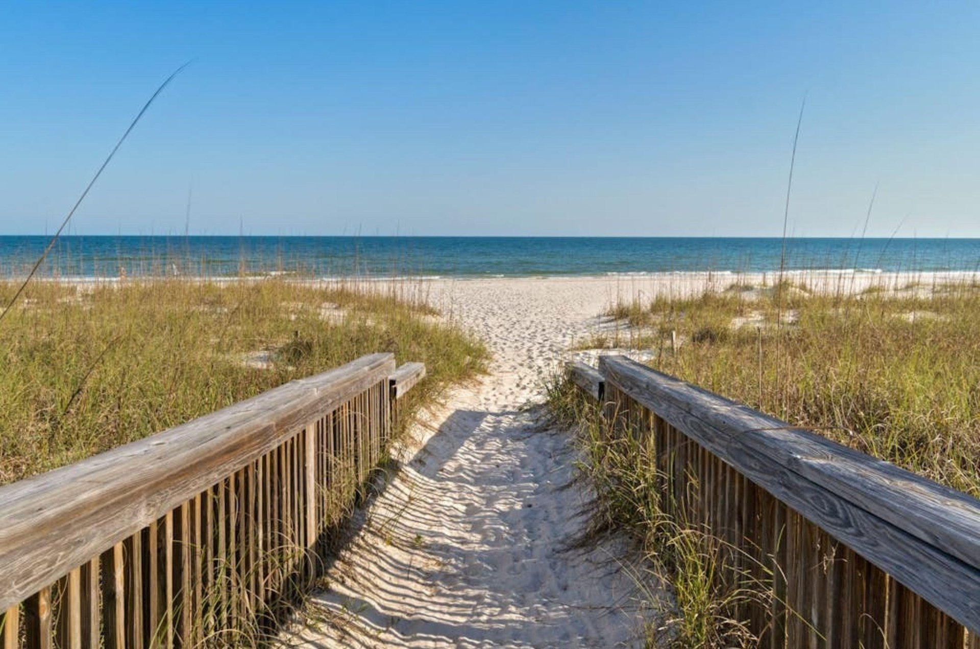Wooden boardwalk leading to the beach and Gulf at Molokai Villas