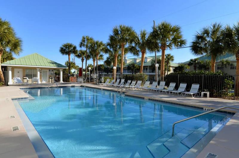 Spacious outdoor swimming pool with plenty of deck loungers at Caribbean Dunes.