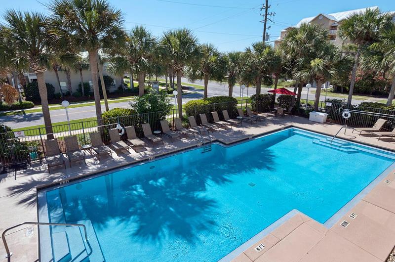 Caribbean Dunes swimming pool and sundeck with lounge chairs.