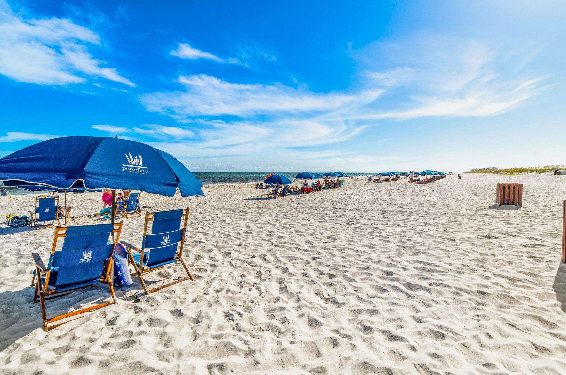 Relax by the stunning Gulf with beachside lounge chairs