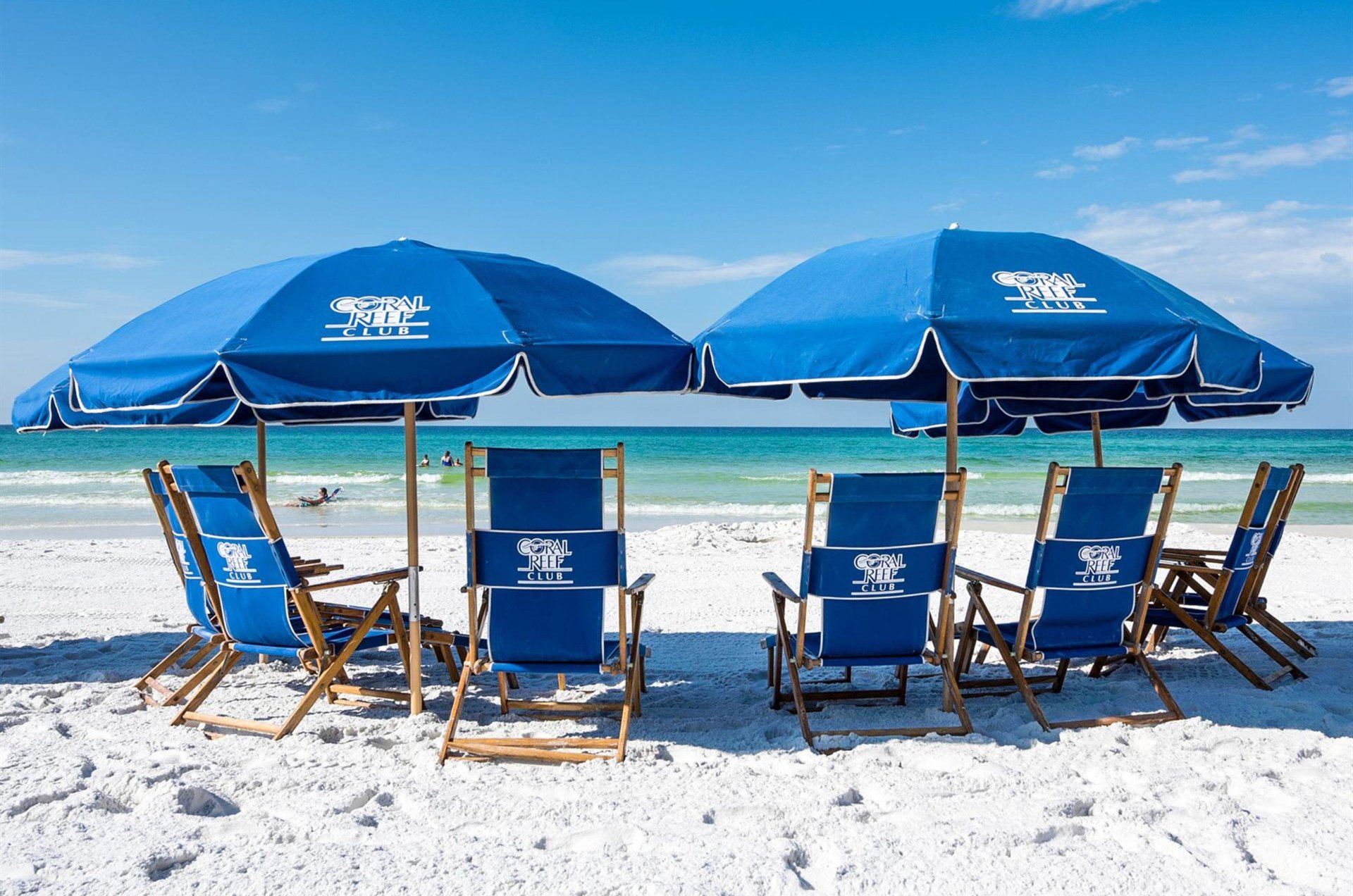 Coral Reef Clubs beach chairs and umbrellas.