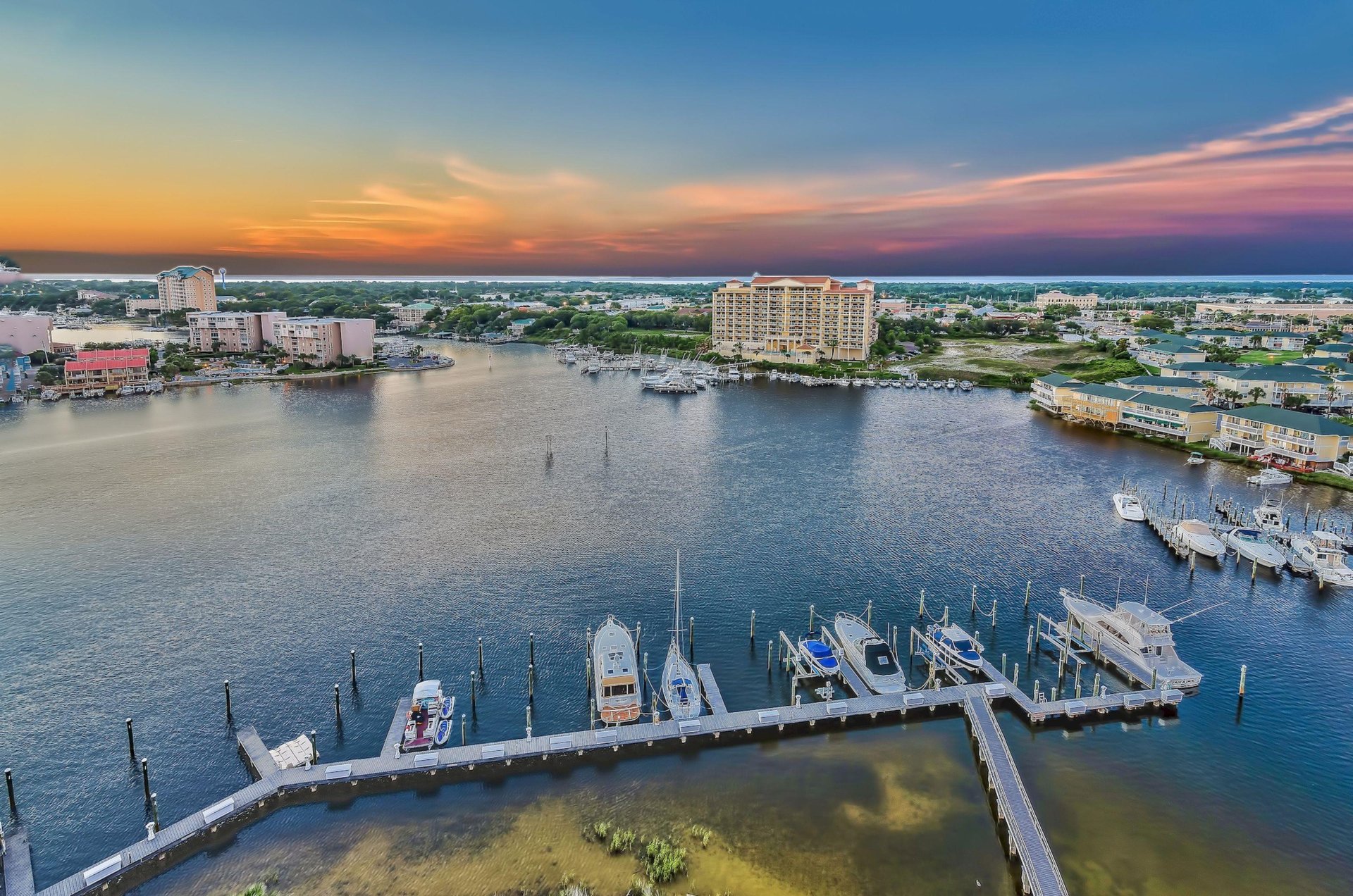 View of the bay and Destin Harbor at sunset from a private balcony