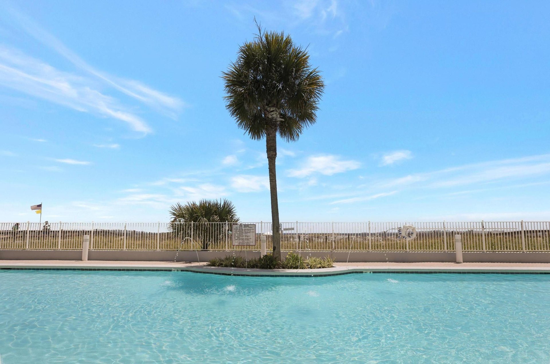 Relax next to the pools with amazing Gulf views