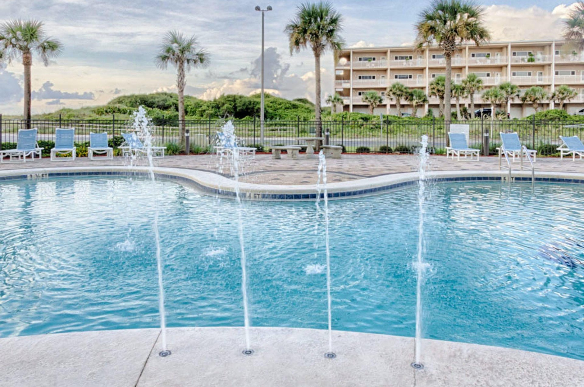 Relax by the outdoor pool at Emerald Dolphin