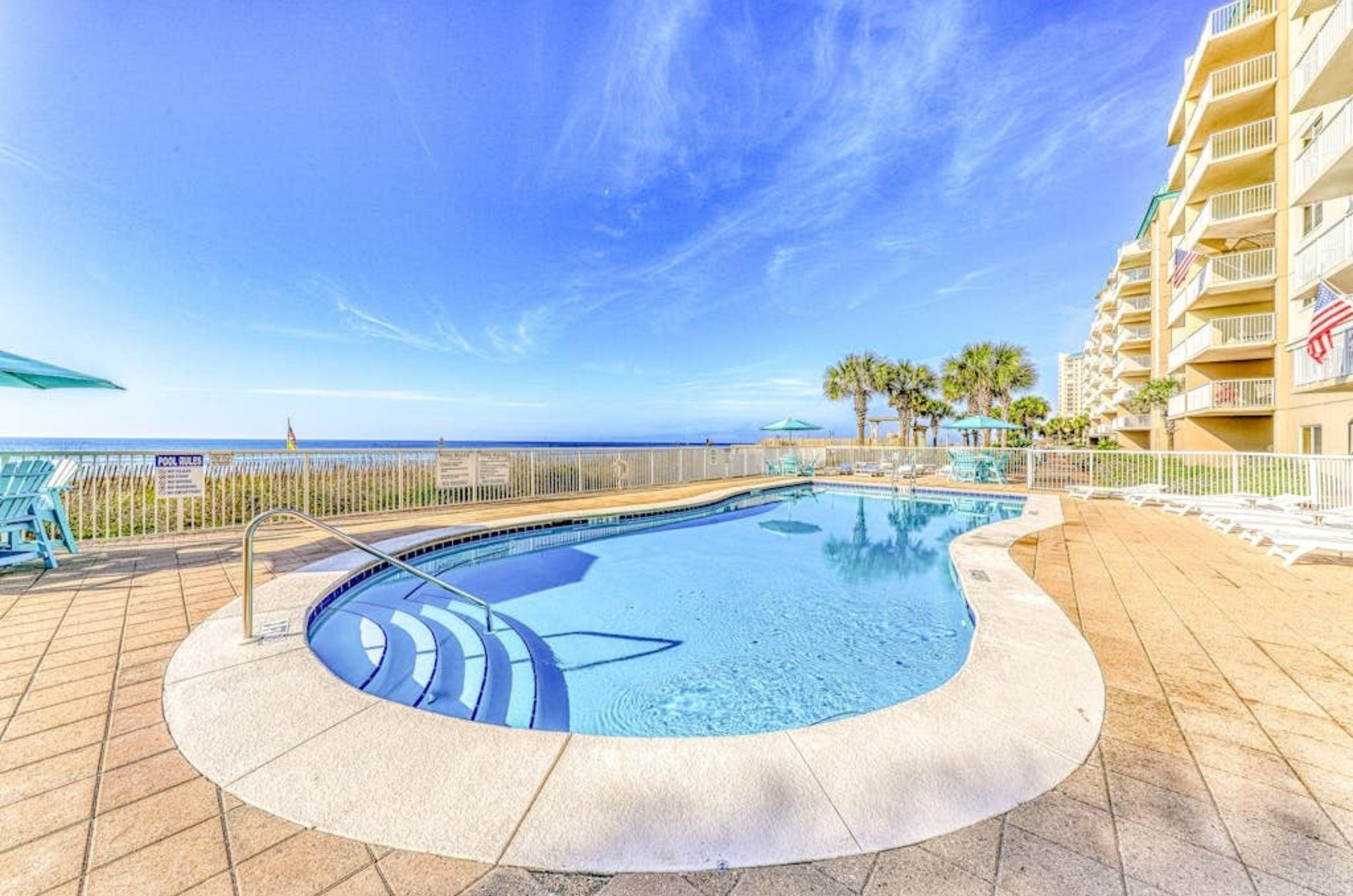 The beachside outdoor swimming pool in front of Sandy Key Condos in Perdido Key Florida