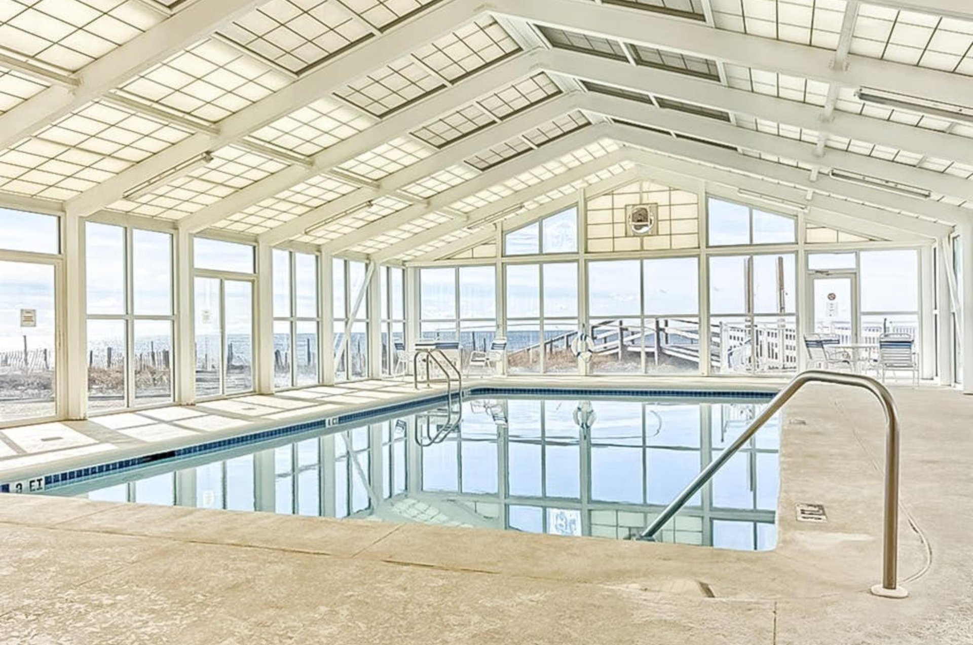 The indoor pool surrounded by windows at Perdido Sun in Perdido Key Florida
