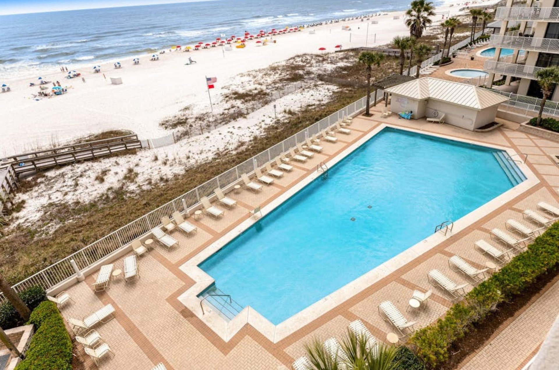 Aerial view of the outdoor pool and pool deck at Pelican Pointe in Orange Beach Alabama