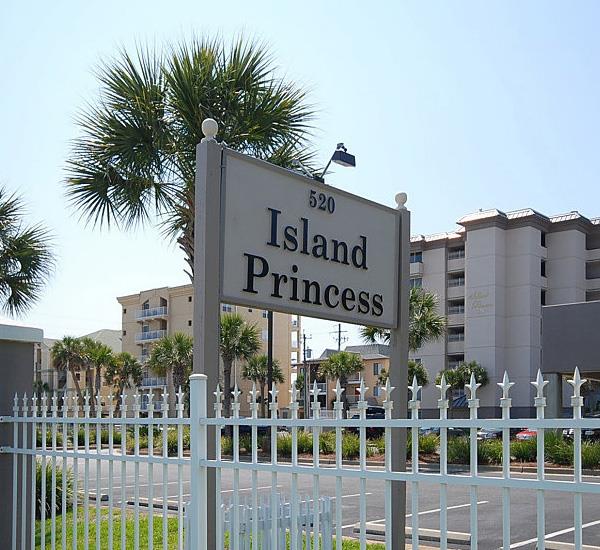 Streetside sign inside fenced grounds at Island Princess Fort Walton