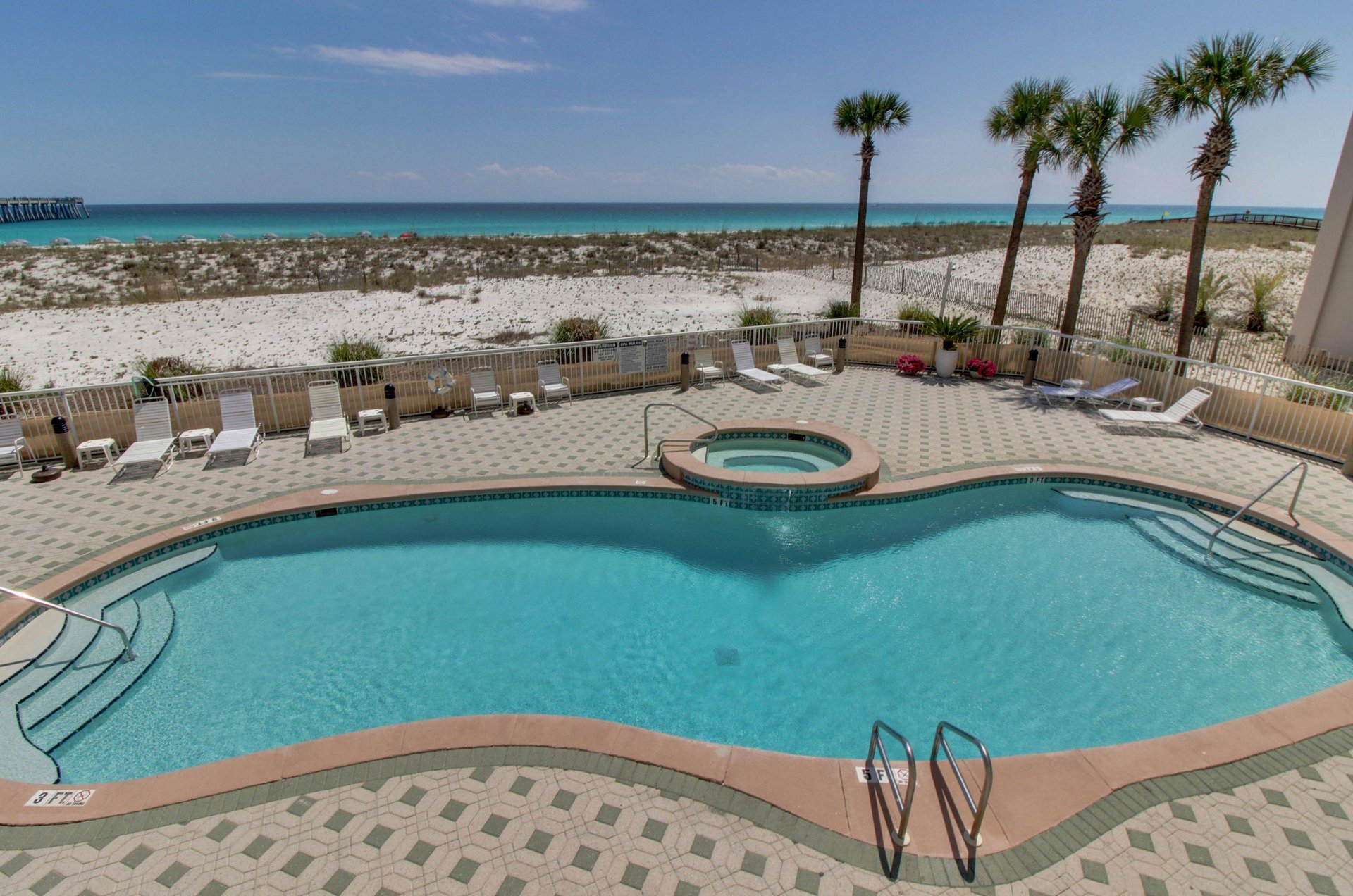 Unwind by the beachfront swimming pools at Summerwind Resort