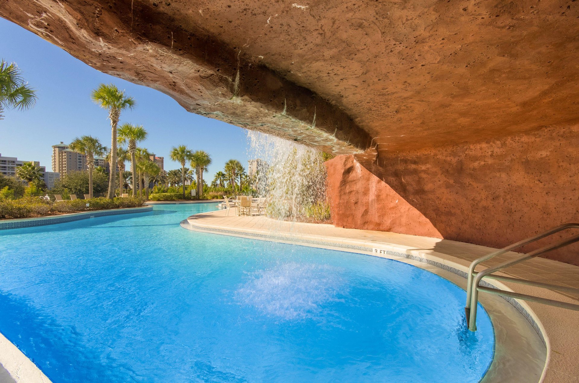 One end of the lagoon pool winds up in a cavelike structure with a waterfall cascading over the entrance