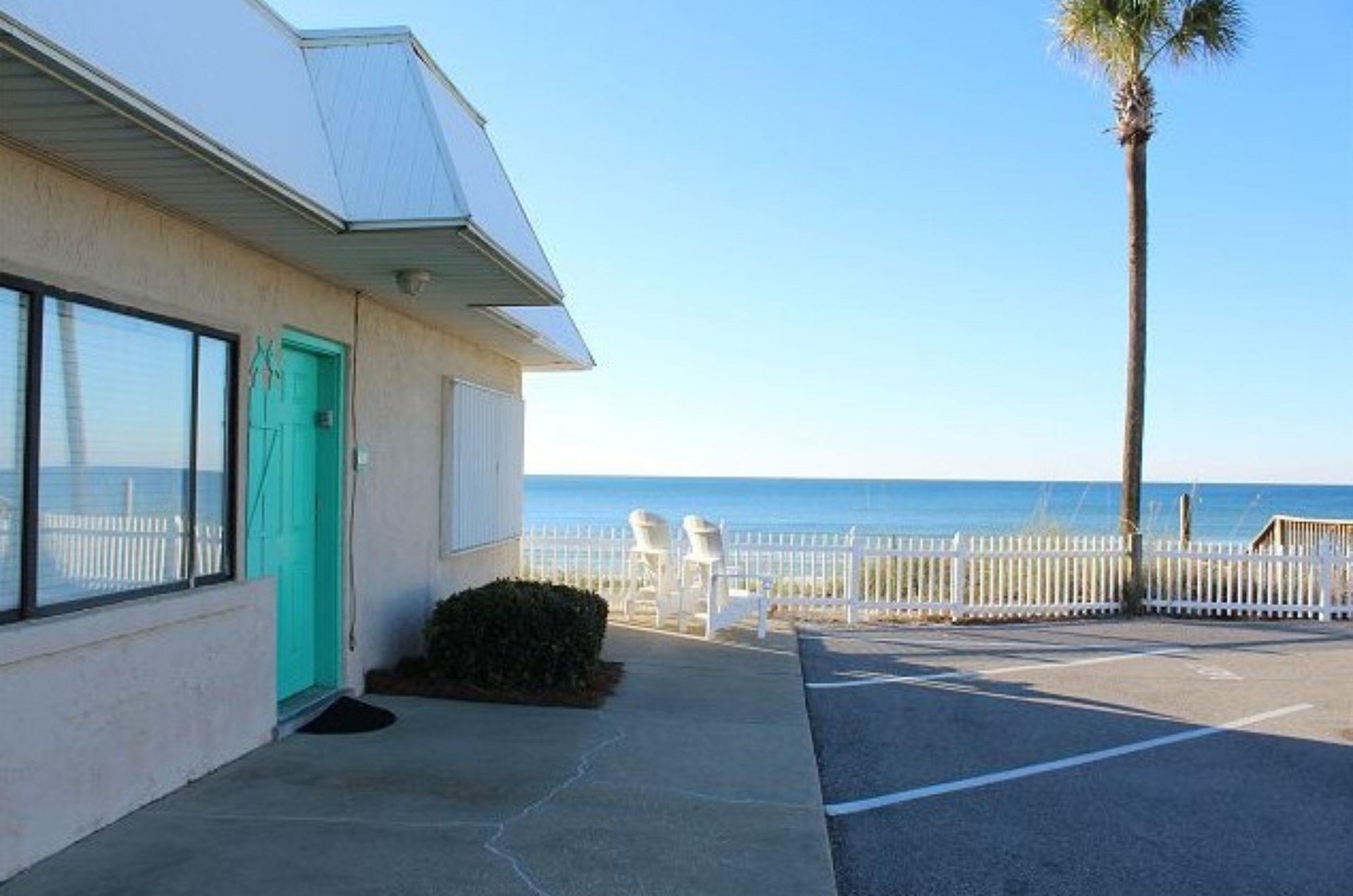 Adirondack chairs  provide seating overlooking the beach.