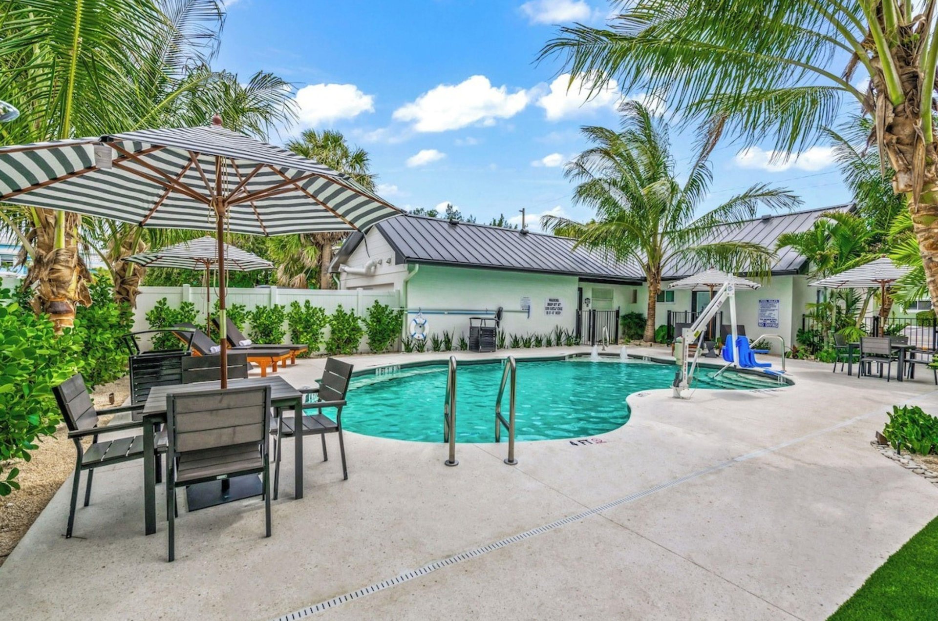 The outdoor swimming pool close to Seabreeze at Anna Maria Island Inn