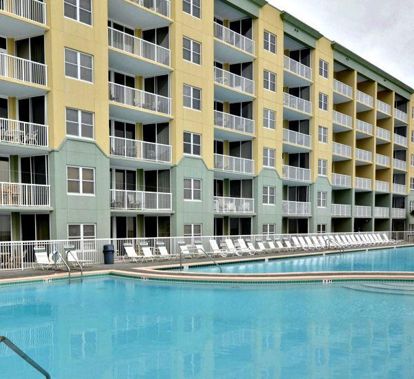 Beachside exterior view and Gulffront swimming pool at Waters Edge Condos in Fort Walton FL