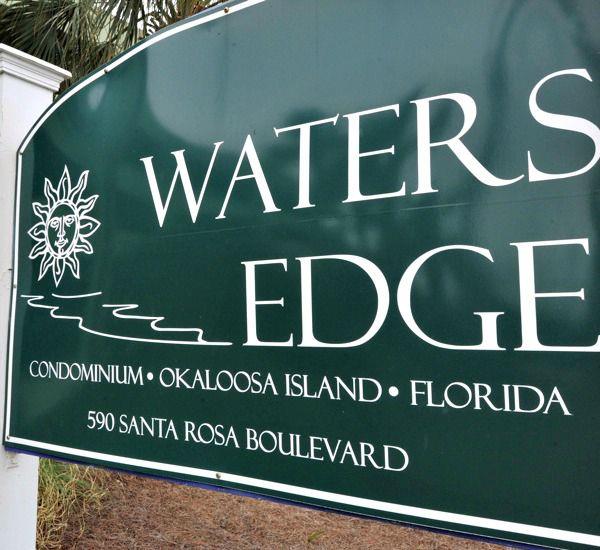 Streetside sign at Waters Edge Condos in Fort Walton Florida
