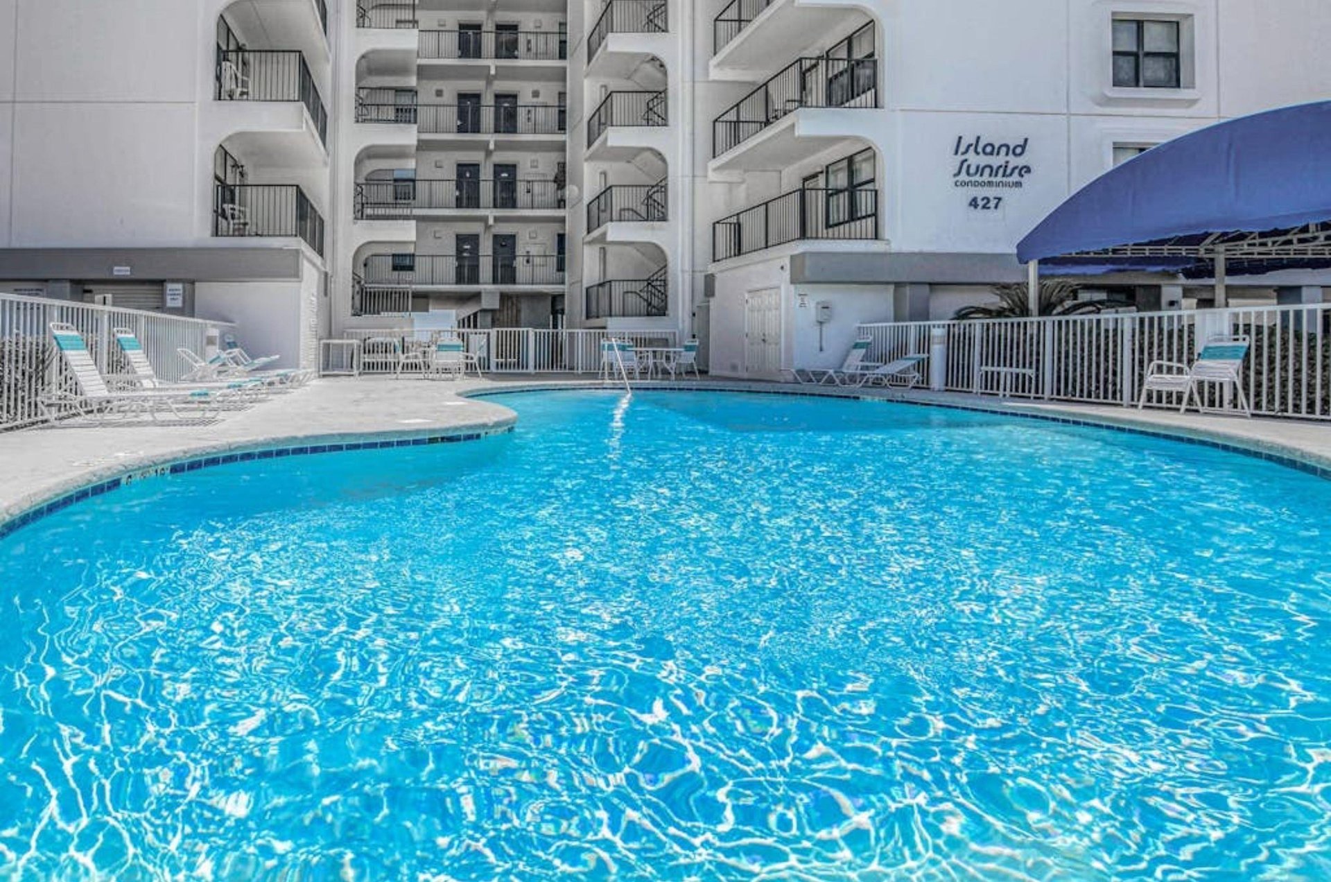 The spacious outdoor swimming pool at Island Sunrise in Gulf Shores Alabama