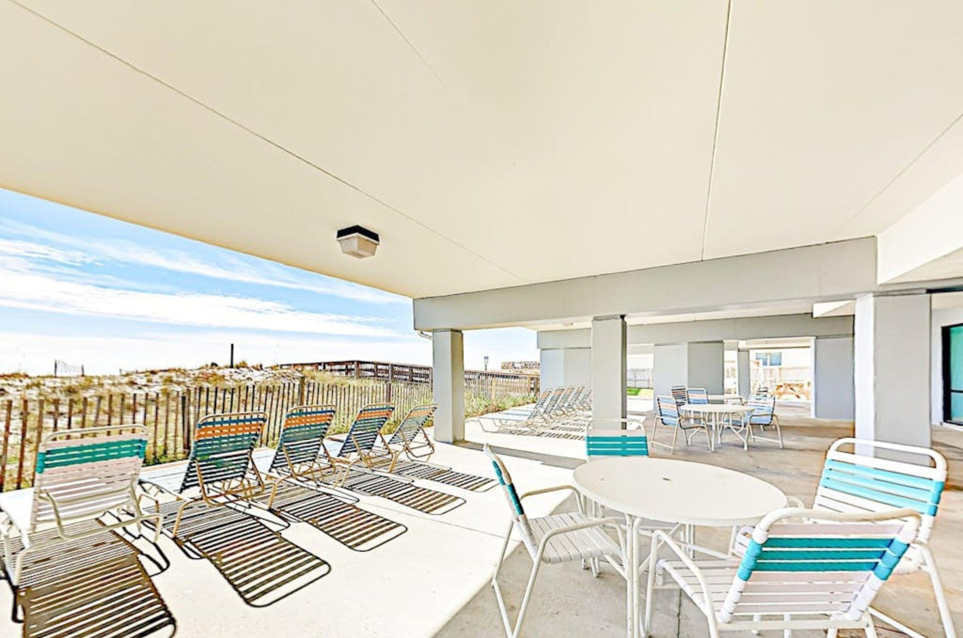 The beachfront lounge chairs under Island Sunrise in Gulf Shores Alabama