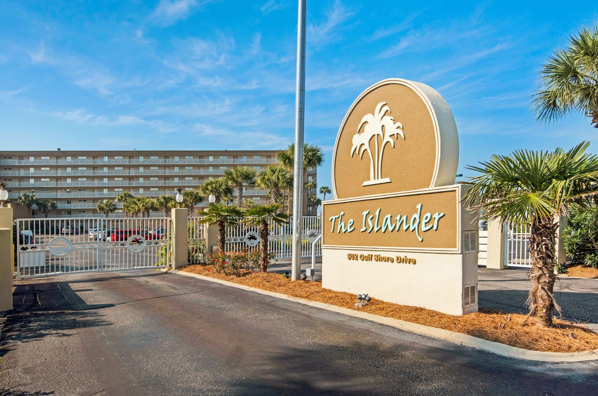 The front entrance gate and sign