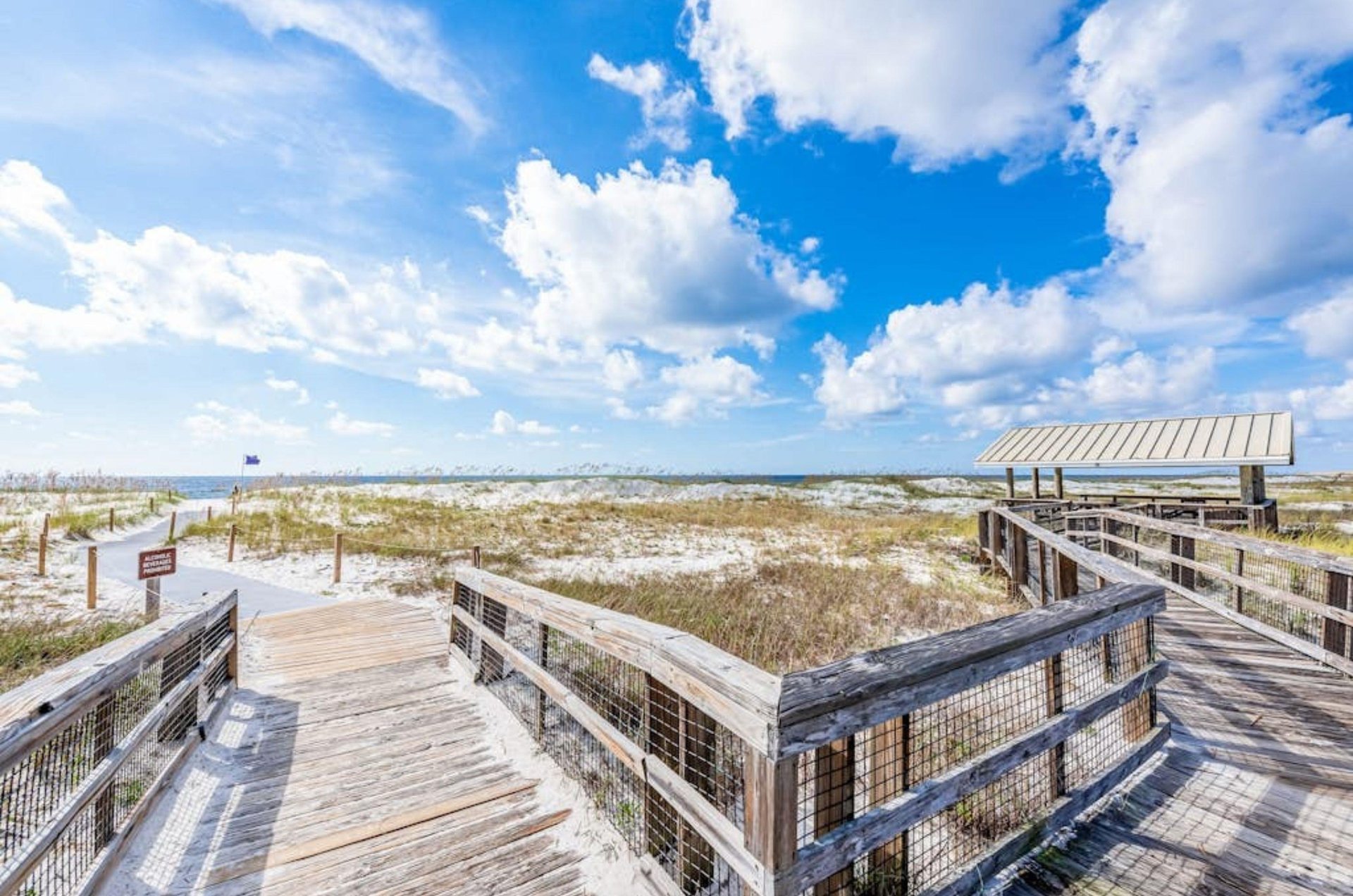The wooden boardwalk leading to the beach at Ocean Breeze West