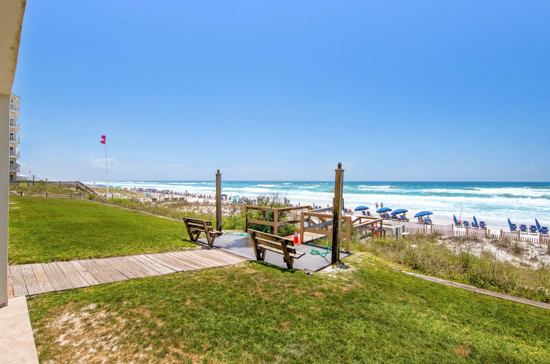 The outdoor showers and boardwalk to the beach.