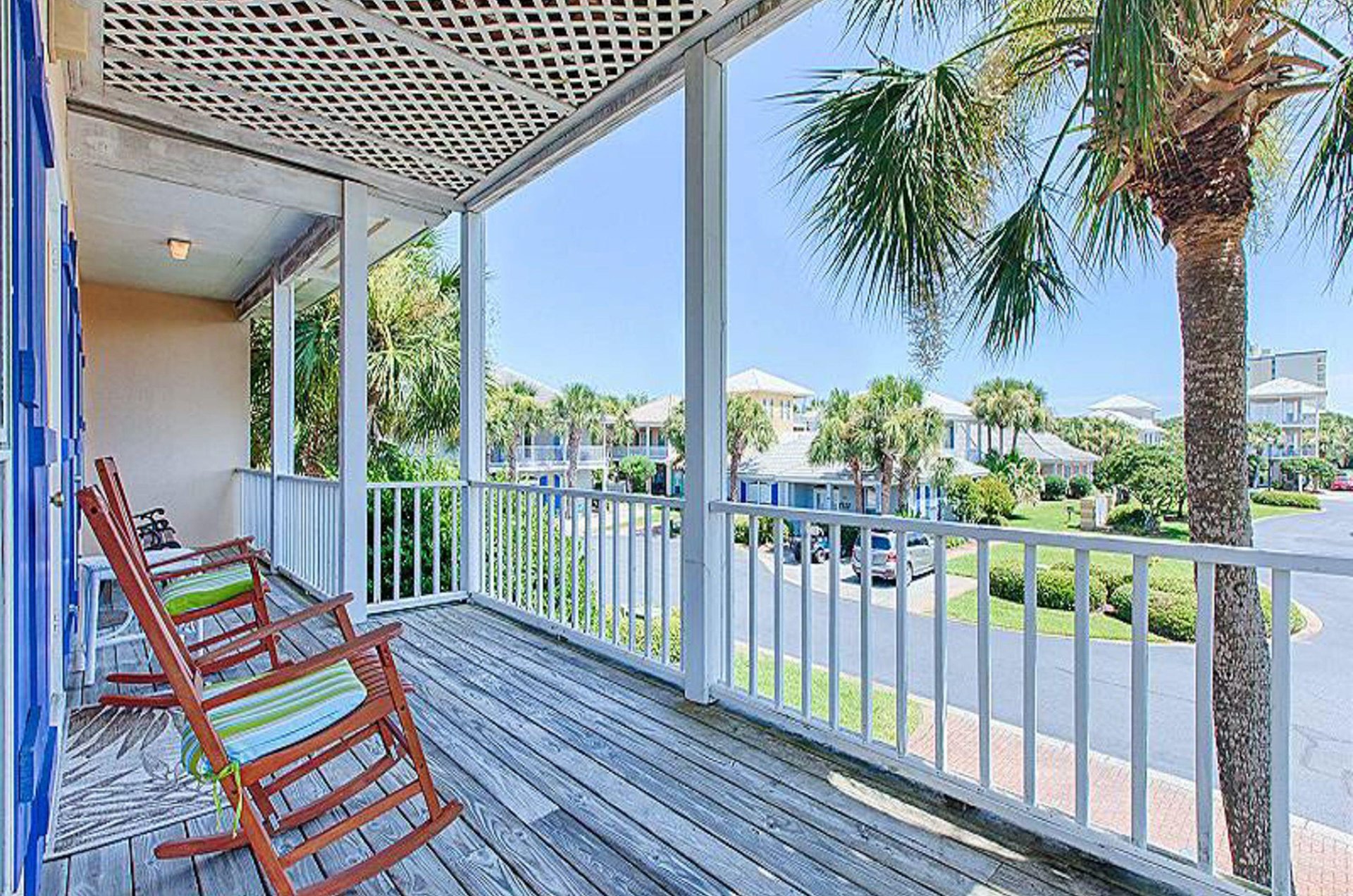 Homes have decks with seating arrangements set up for relaxing outdoors.