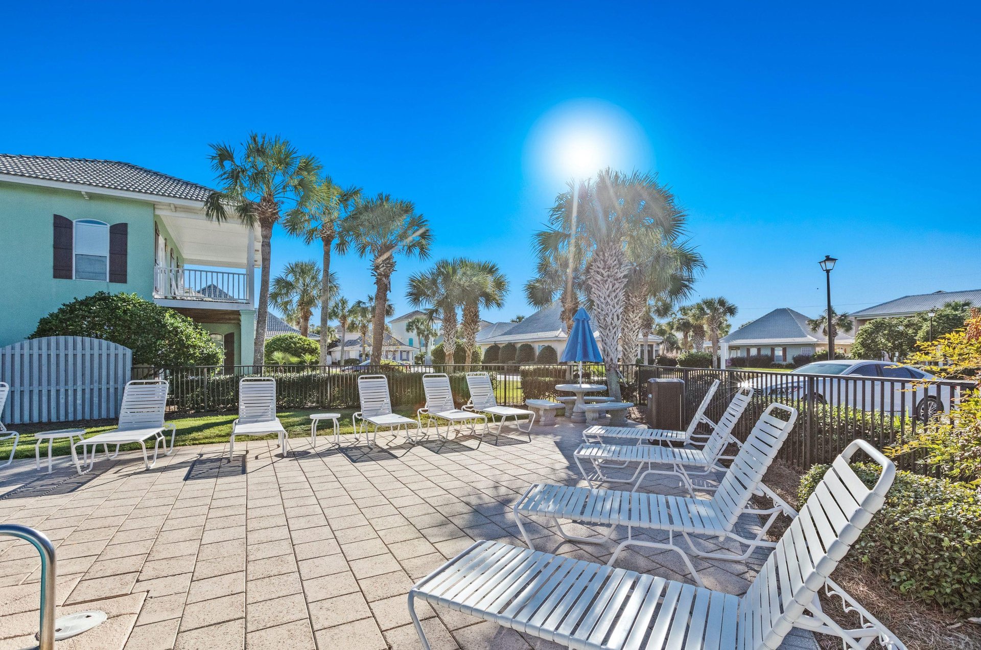 The community pools sundeck is furnished with longers for relaxing in the sun.