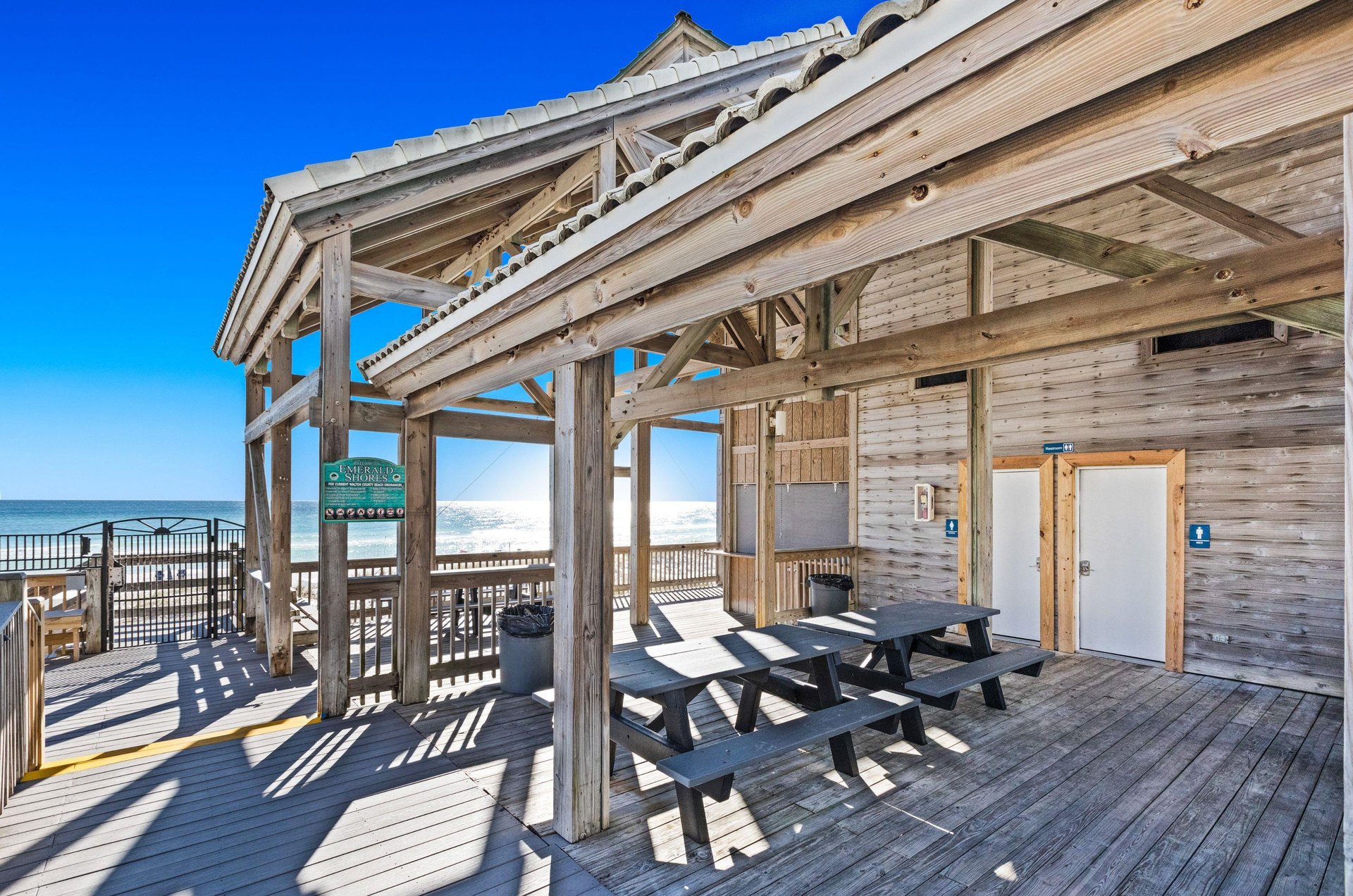 The neighborhood has a private deck with bathrooms and a gated boardwalk to the beach.