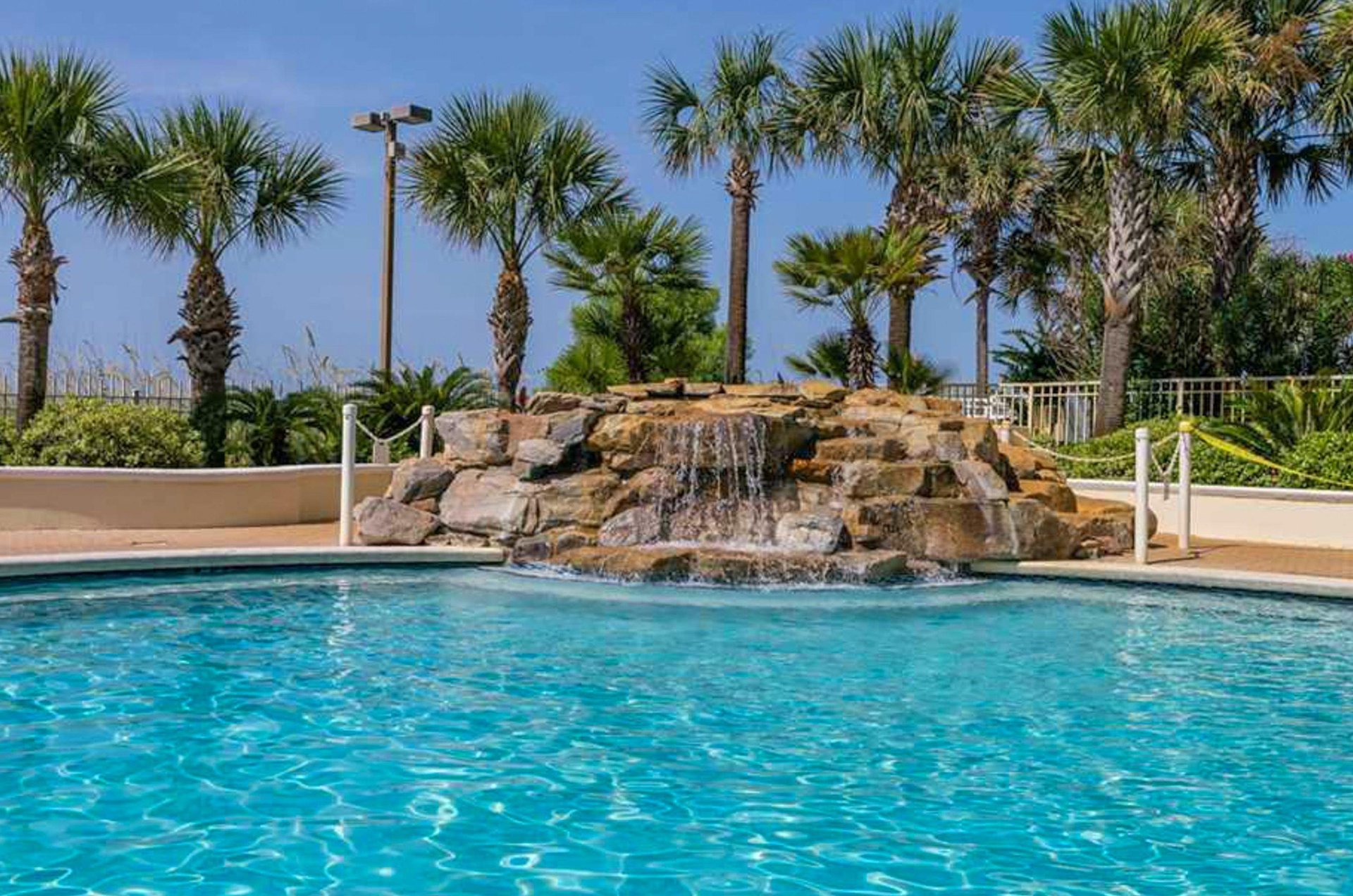 Waterfall cascading into the community pool