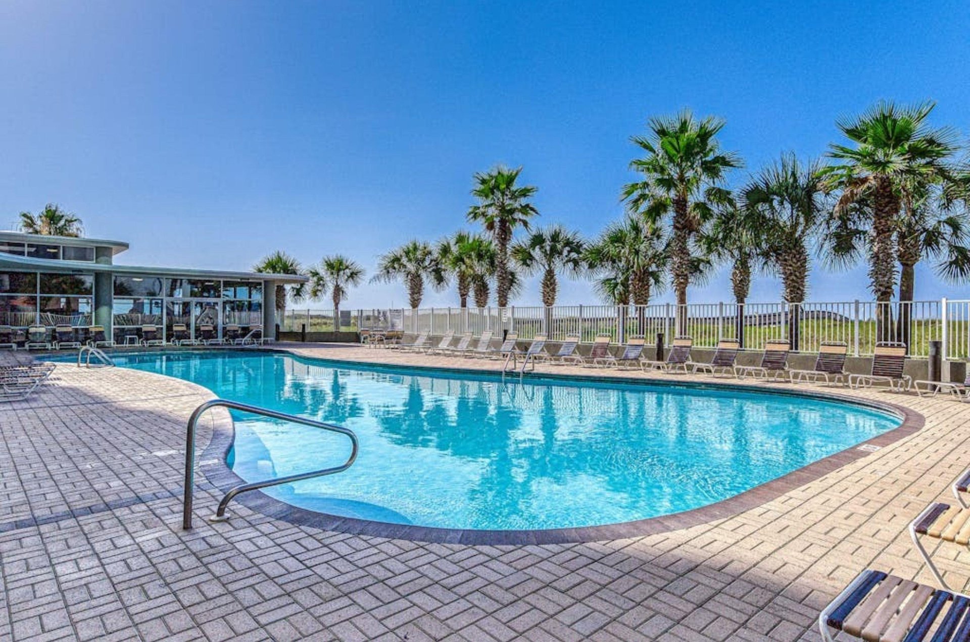 The outdoor swimming pool at Tidewater Beach Resort Condominiums