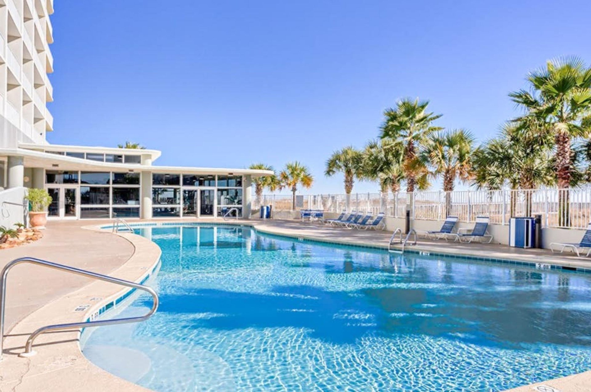The beachfront swimming pool at Tidewater Beach Resort Condos in Orange Beach Alabama