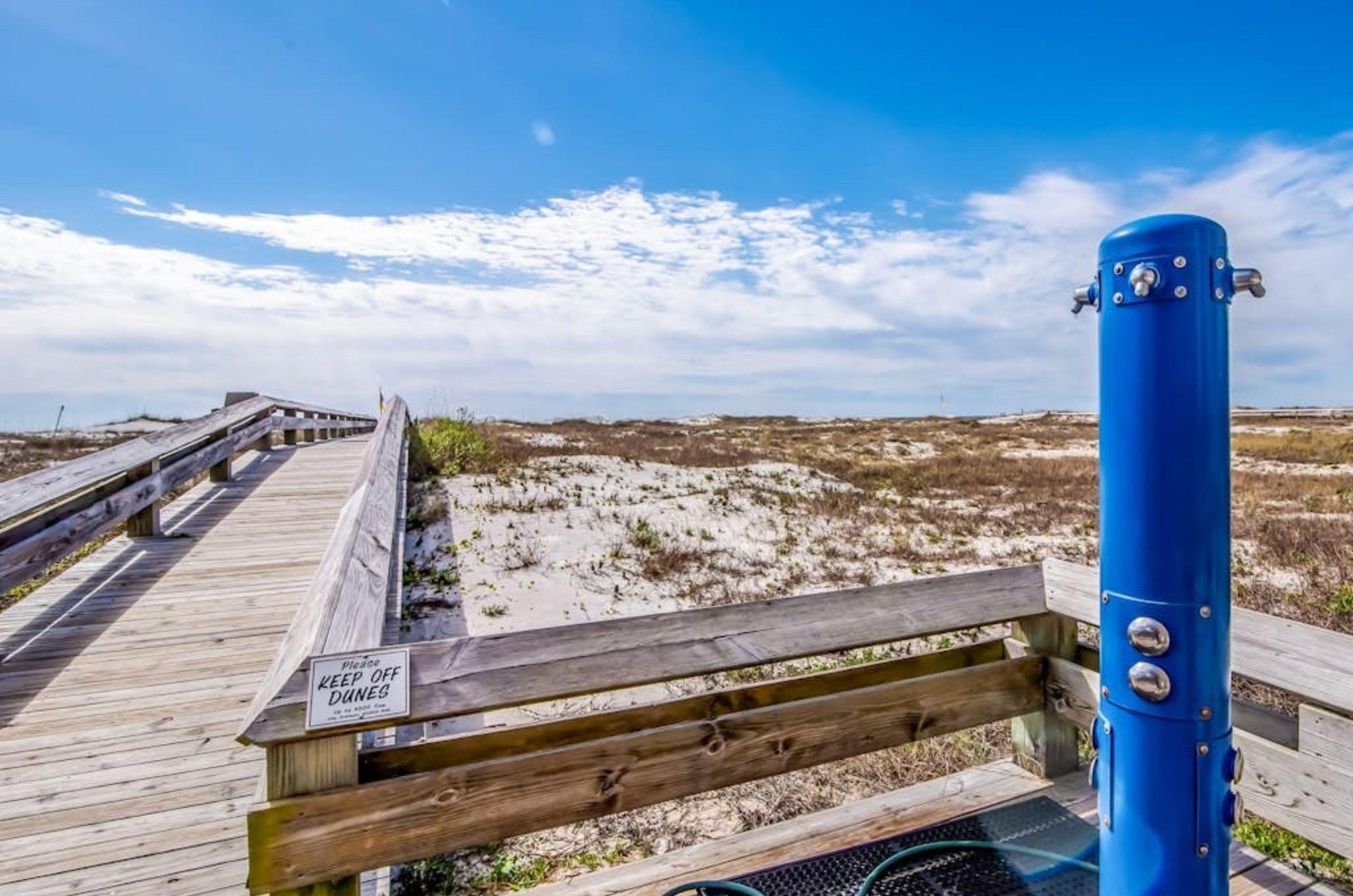 The outdoor shower on the boardwalk at Phoenix II in Orange Beach Alabama