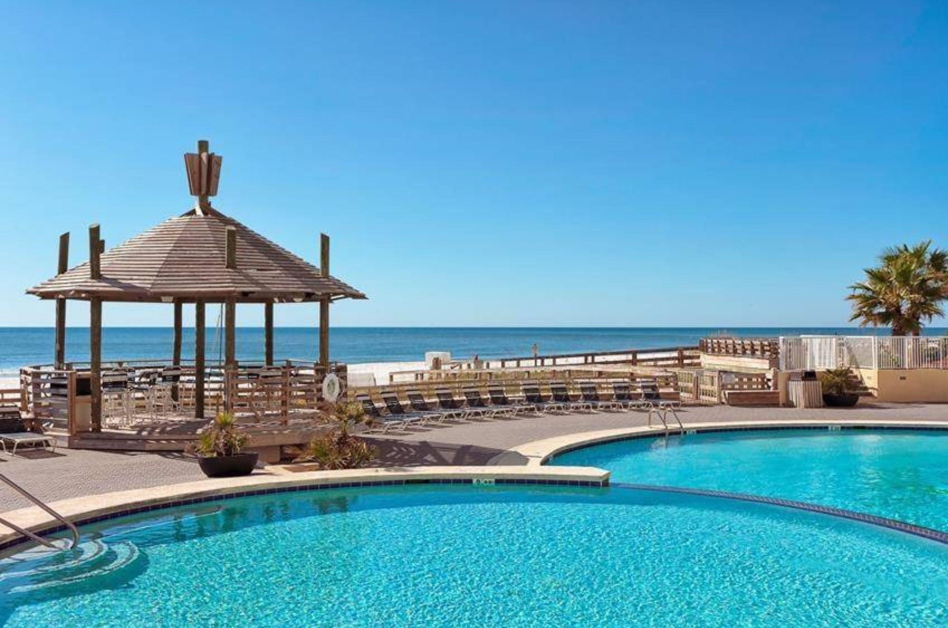The outdoor pool and gazebo at Summer House on Romar Beach in Orange Beach Alabama