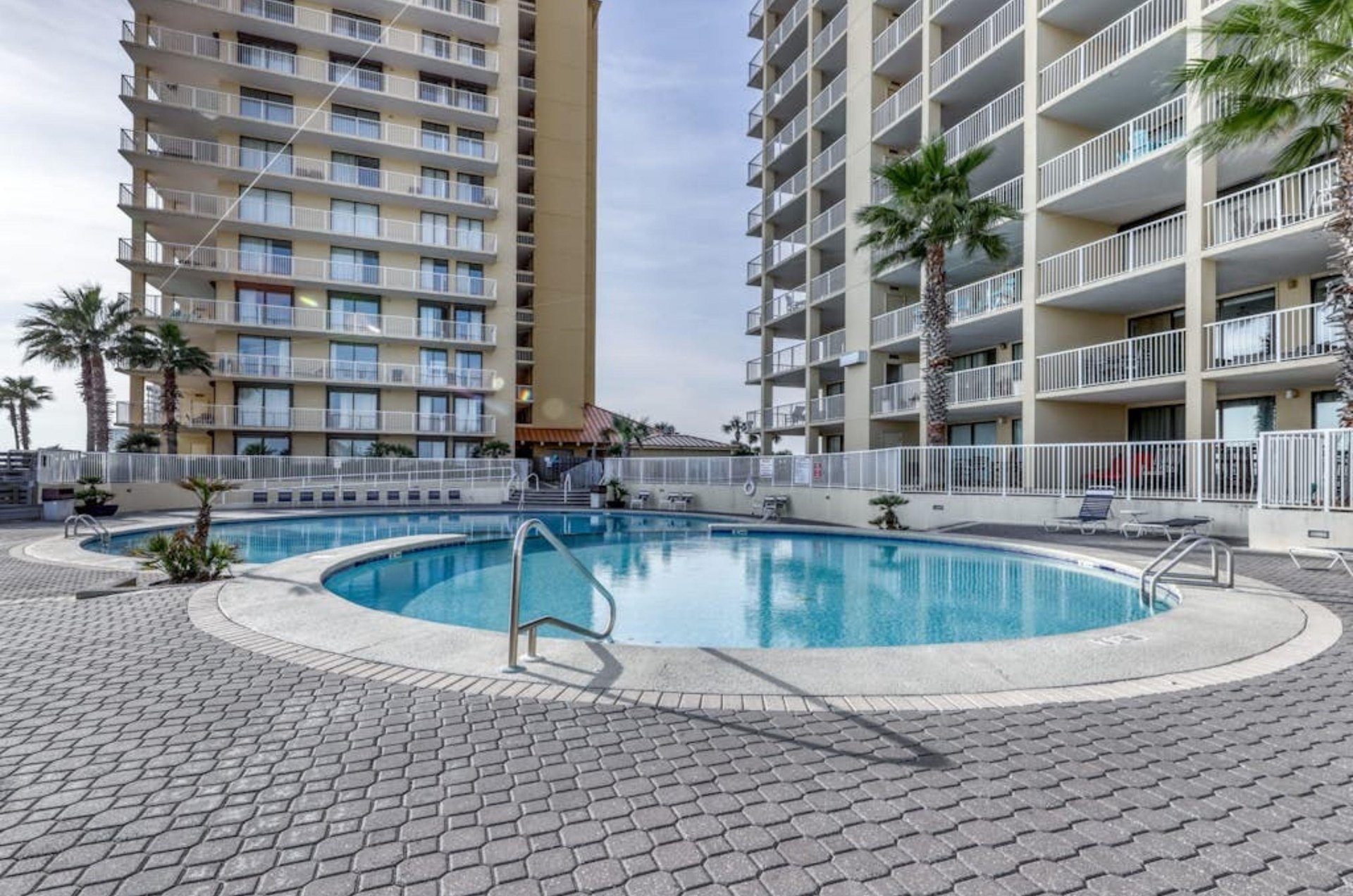 Swim in the lovely outdoor pool at Summer House on Romar Beach in Orange Beach, Alabama