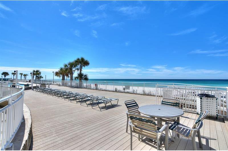 Relax on the pool deck that overlooks the Gulf at Watercrest Condominiums in Panama City Beach Florida