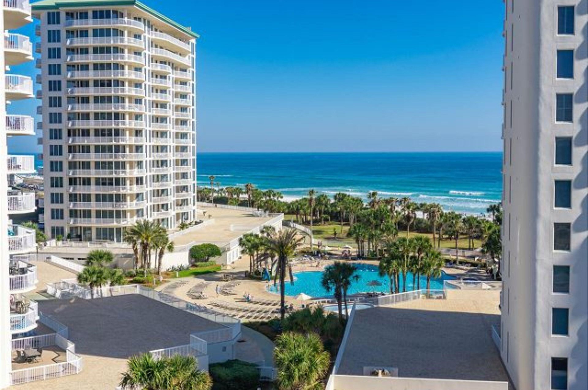 Balconies offer views of the pool and beach beyond