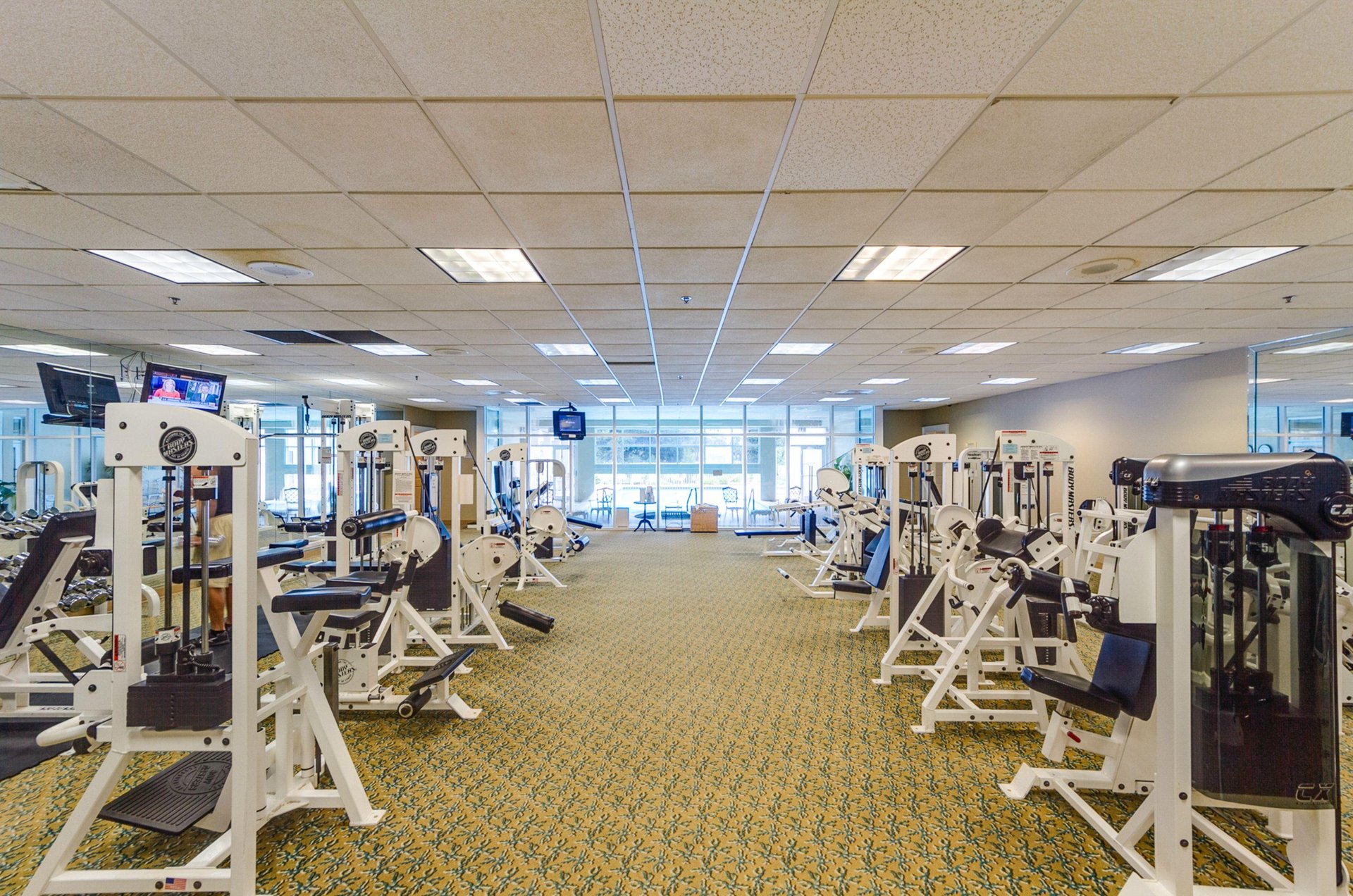 The wellequipped fitness room stands ready for guests