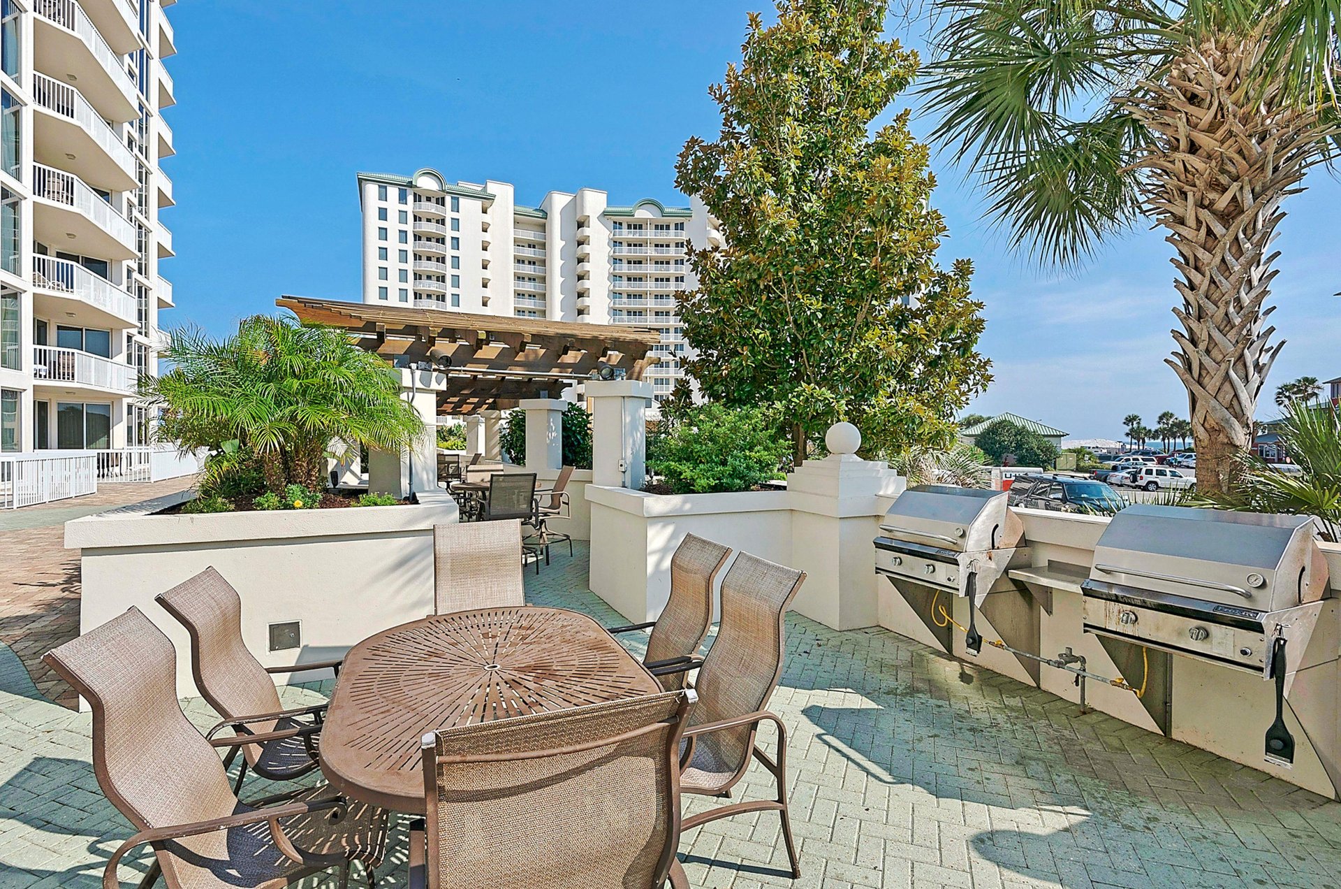 Gas grills with tables and chairs provide a convenient place for fixing dinner and dining outdoors