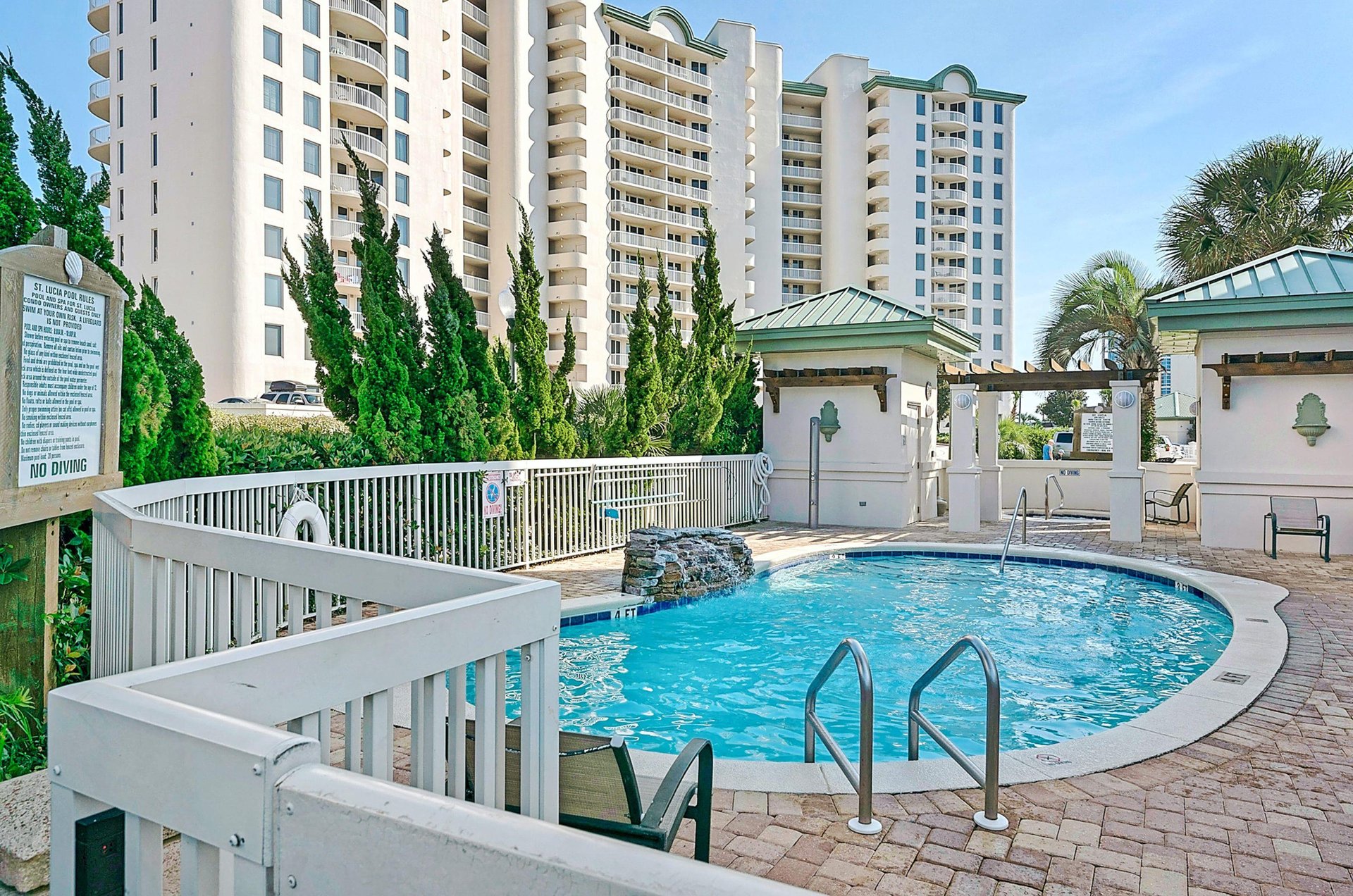 A community pool with a waterfall