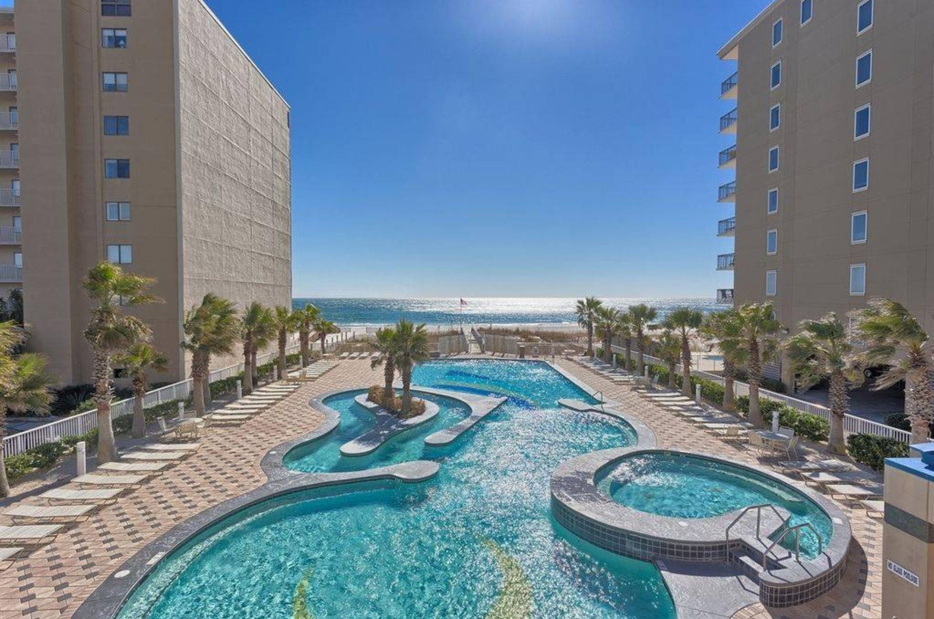 The beachfront pool lazy river and hot tub at Crystal Towers in Gulf Shores Alabama