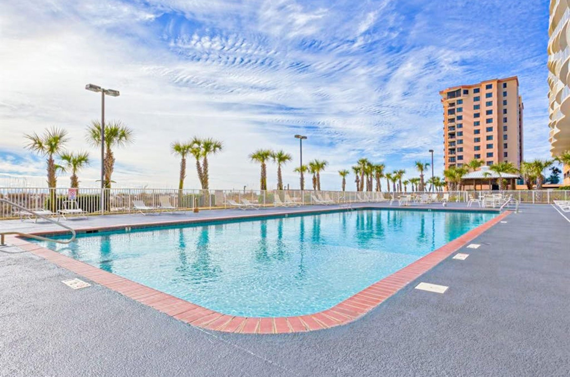 The outdoor swimming pool at Regency Isle in Orange Beach Alabama