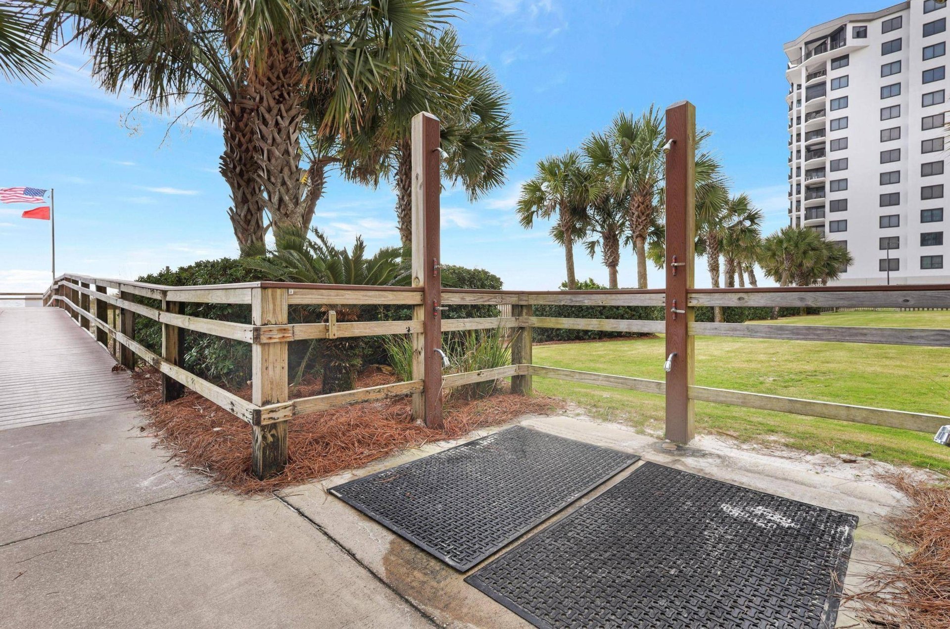 The outdoor showers on the boardwalk at Regency Isle in Orange Beach Alabama