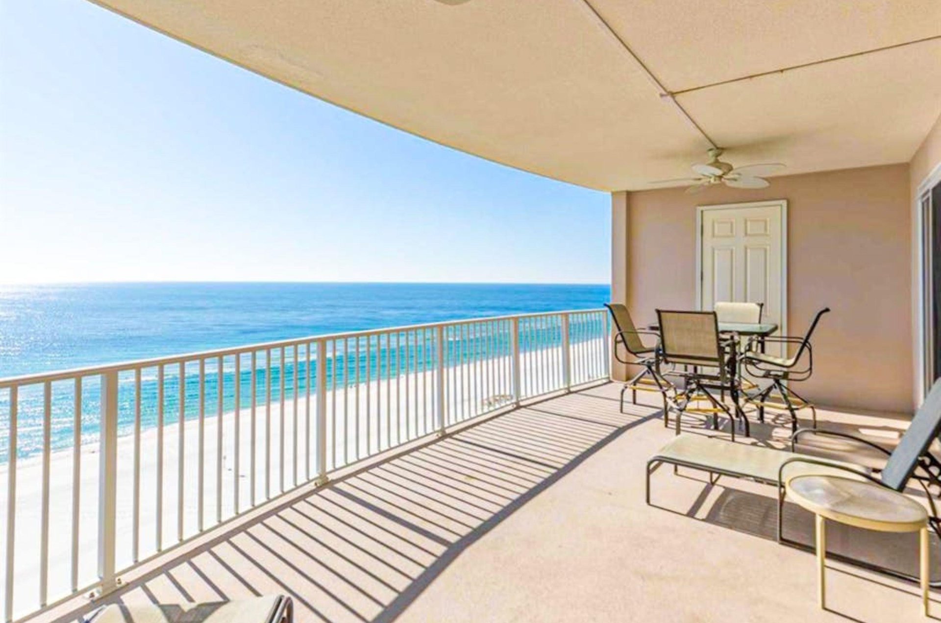A private balcony overlooking the beach at Regency Isle Condominiums