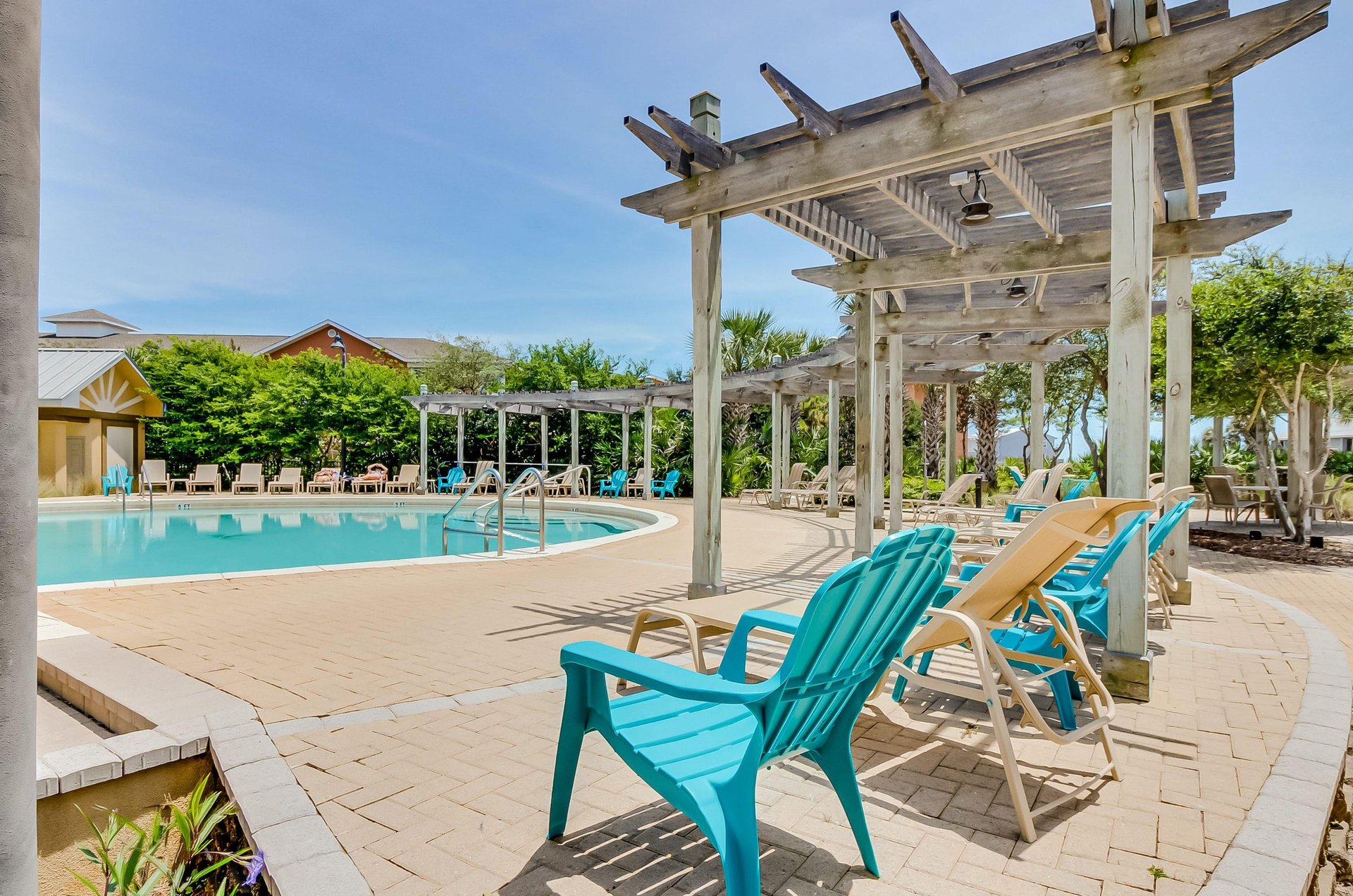 The pool has plenty of lounge chairs for guests to sun beside the sparkling swimming pool.