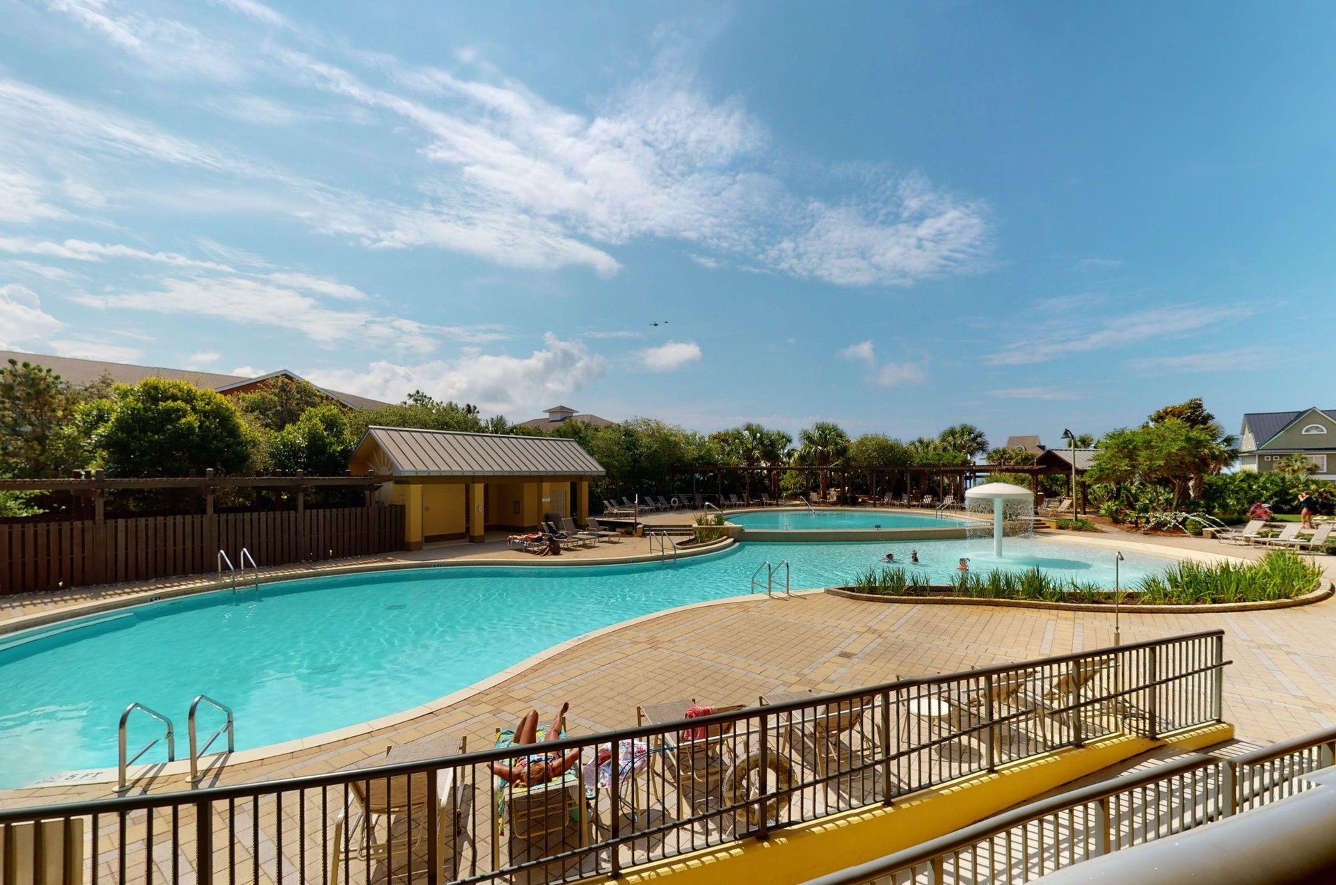 Guests enjoy the shimmering pool and sunning on the large deck.