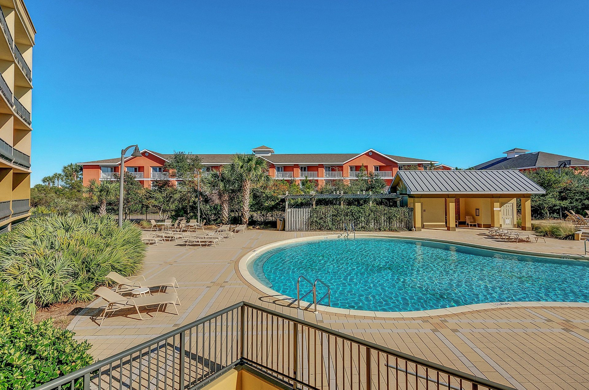 The community swimming pool shimmers under the suns rays.