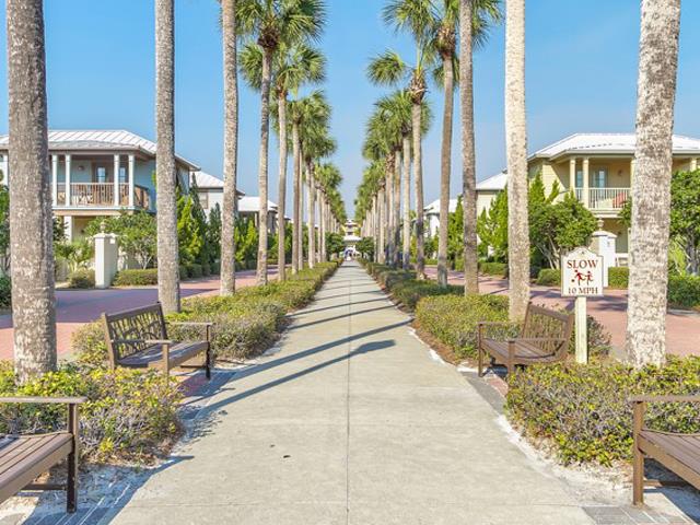 Stroll along the palmlined walkway at Inn at Seacrest Beach Highway 30A Florida