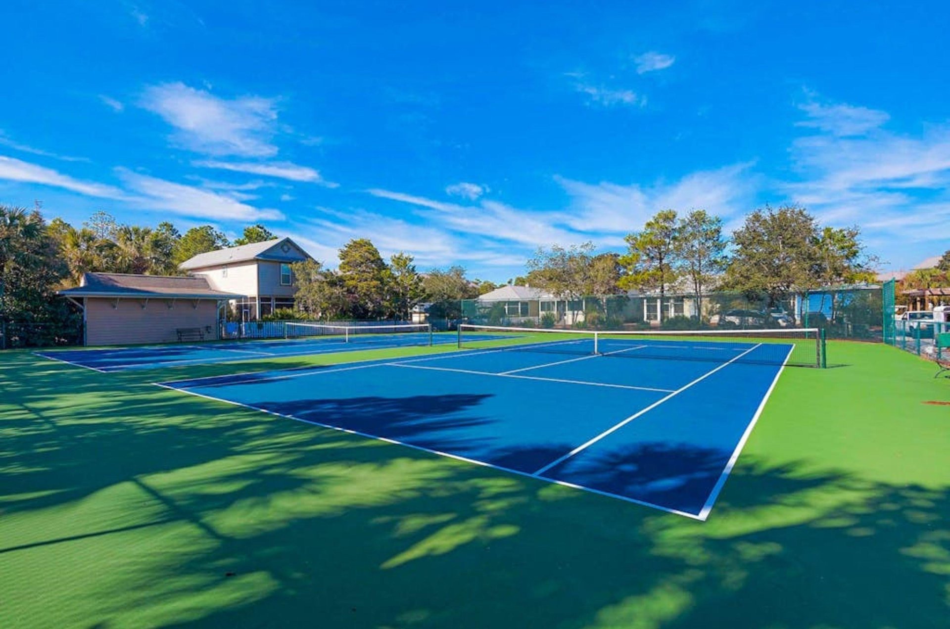 The outdoor tennis court at Cassine Station in Seagrove Beach Florida