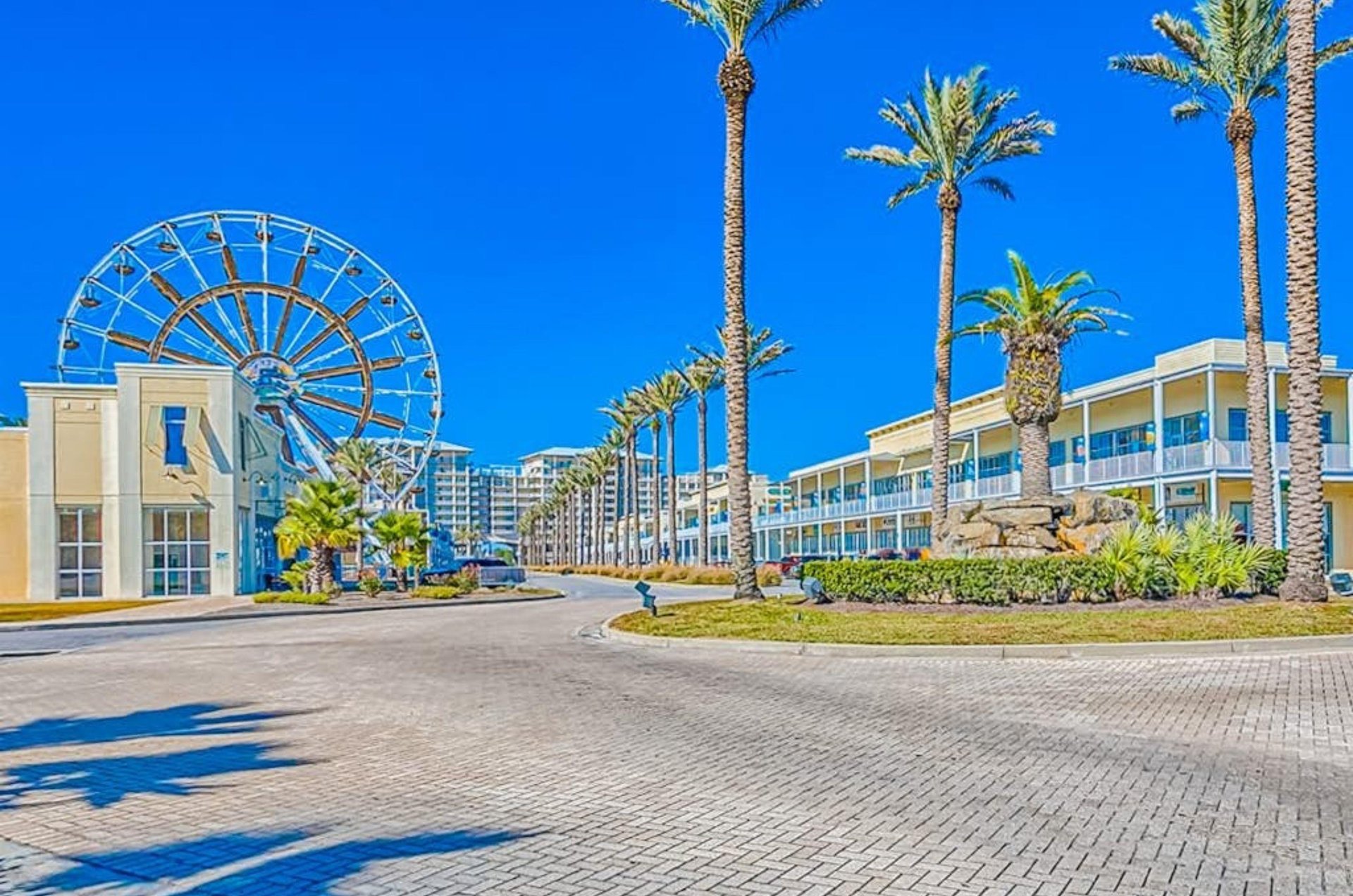 A tall ferris wheel next to the Wharf Condominiums in Orange Beach Alabama